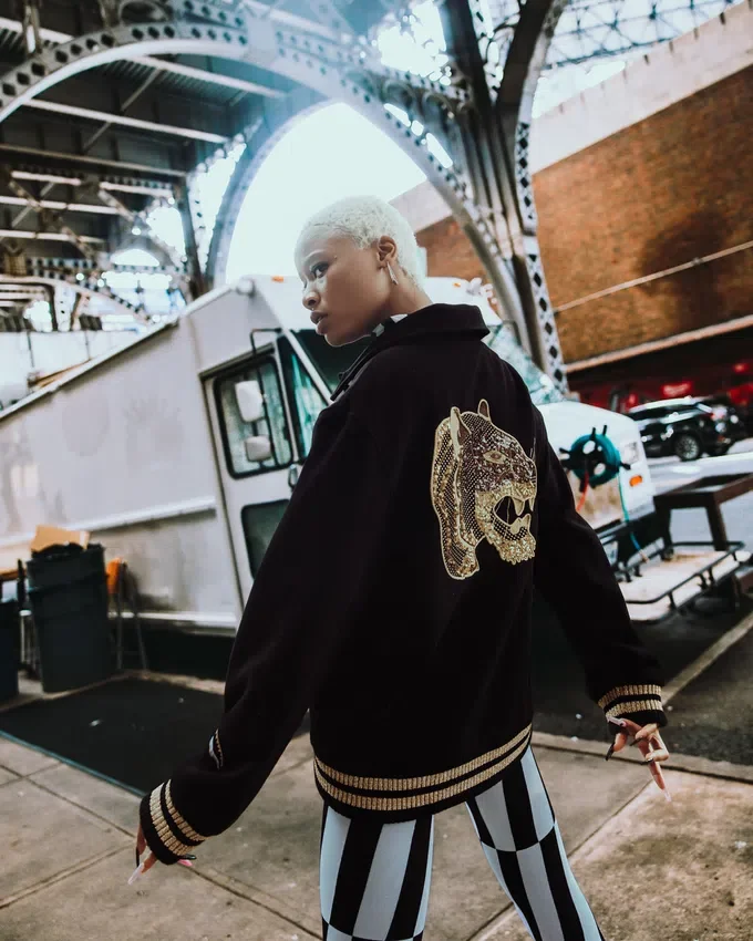 A.I.9 AFRICAN INTELLIGENCE GUILDED LEOPARD - SANDFLOWER COLLAB VARSITY CEKET
